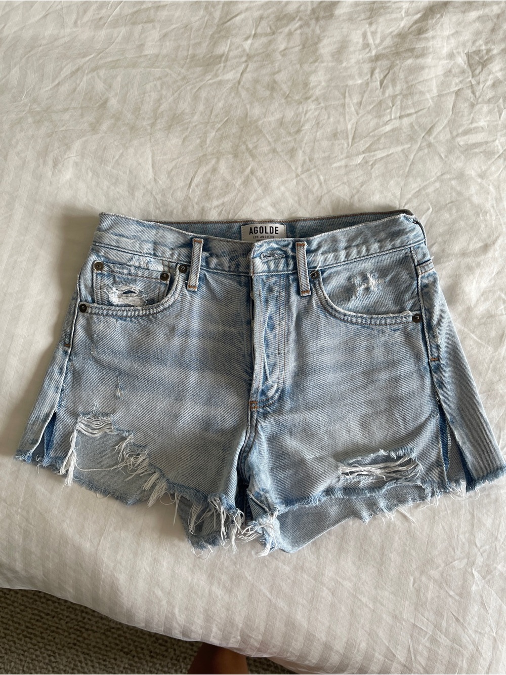 Agolde Faded Light Blue Distressed Denim Cutoff Shorts